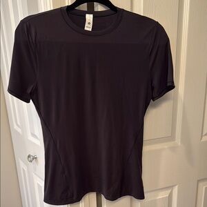 Women’s black short sleeve tee, form fitting. Very soft.